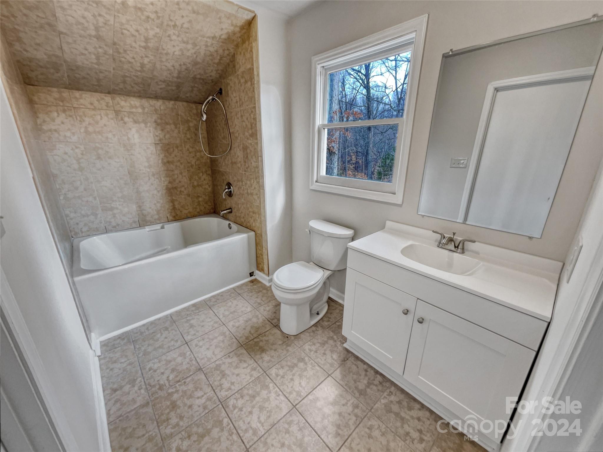 506 Ralph Handsel Boulevard Stanley, NC 28164 - Photo 14 of 18 a bathroom with a sink a toilet and shower