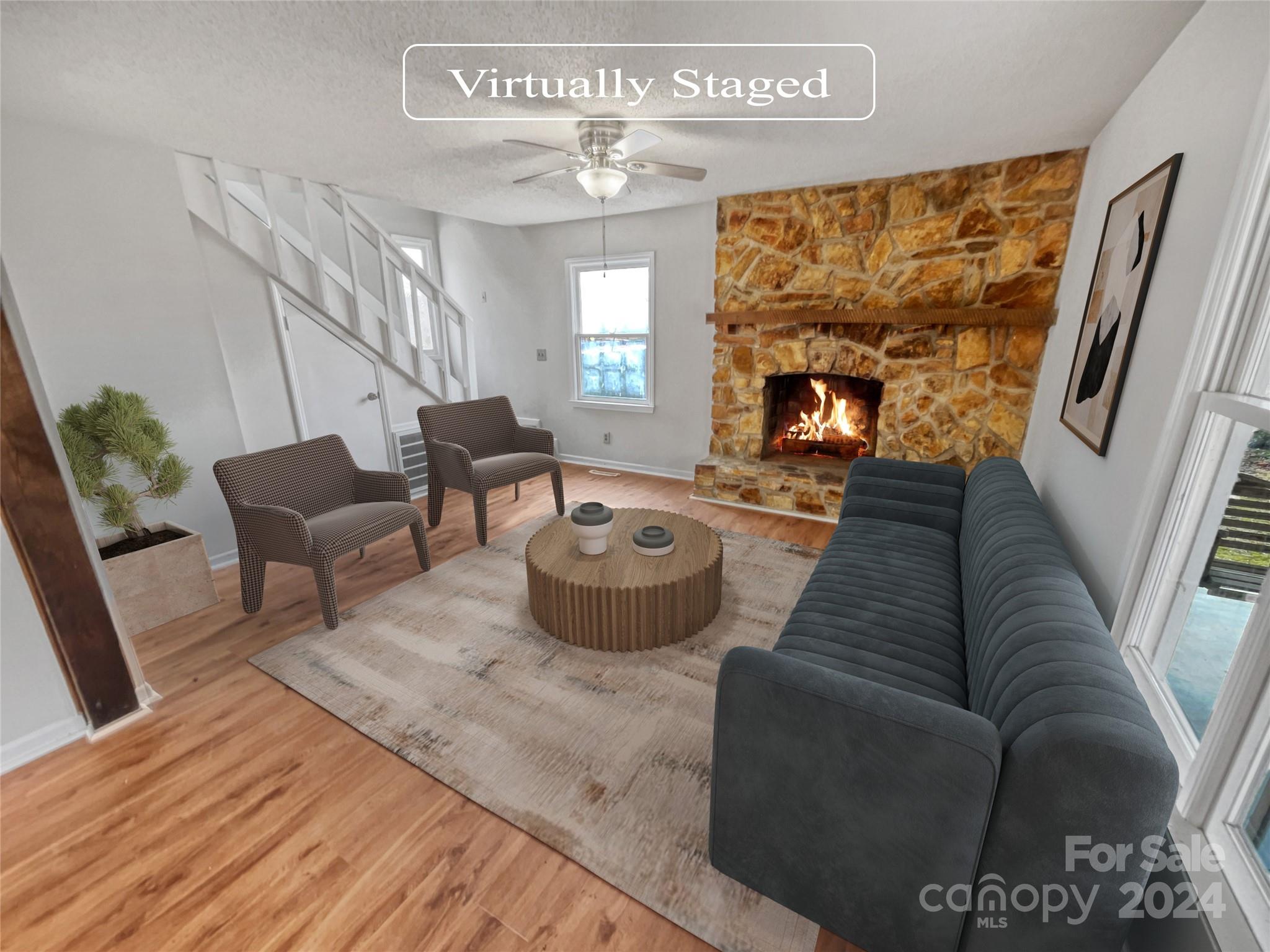 506 Ralph Handsel Boulevard Stanley, NC 28164 - Photo 2 of 18 a living room with furniture and a fireplace