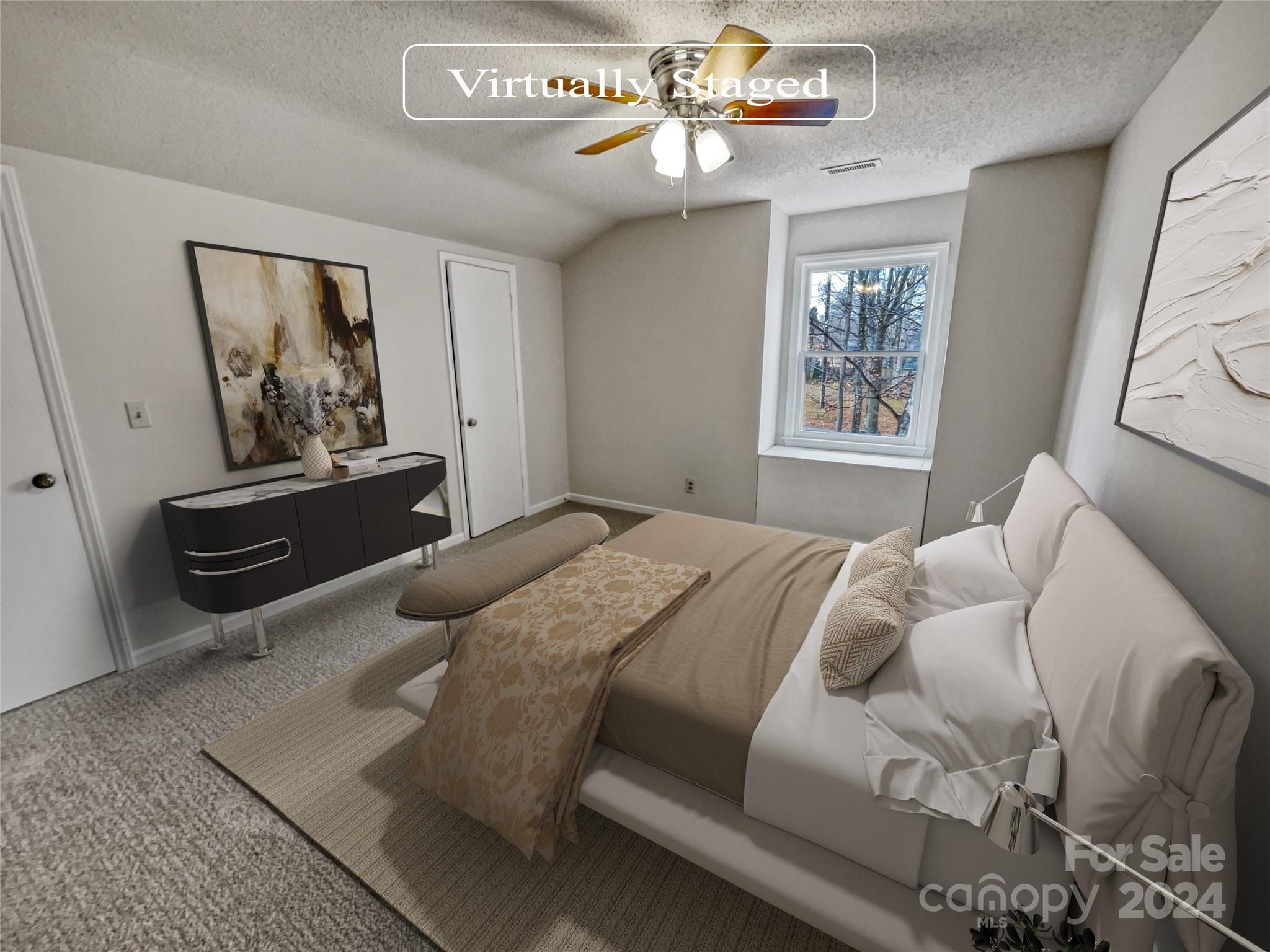 506 Ralph Handsel Boulevard Stanley, NC 28164 - Photo 4 of 18 a bedroom with a bed a window and a chandelier