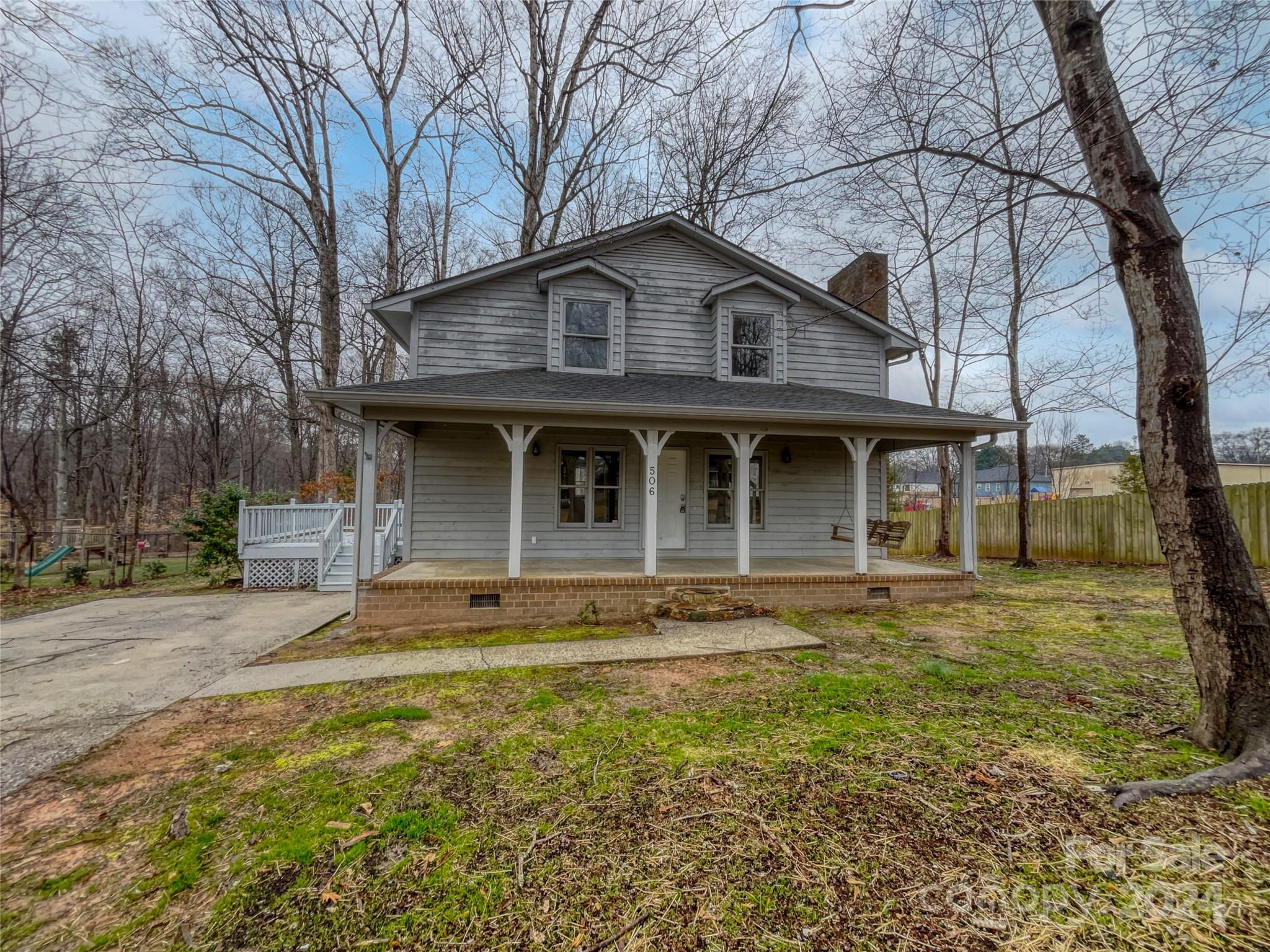 506 Ralph Handsel Boulevard Stanley, NC 28164 - Photo 6 of 18 a front view of a house with a garden
