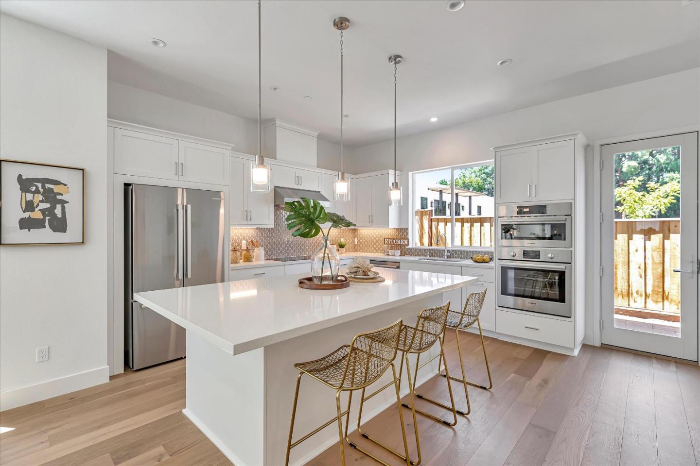 326 Isabelline Court San Ramon, CA 94583 - Photo 7 of 35 a kitchen with stainless steel appliances kitchen island granite countertop a stove a refrigerator a sink a oven and a wooden floors