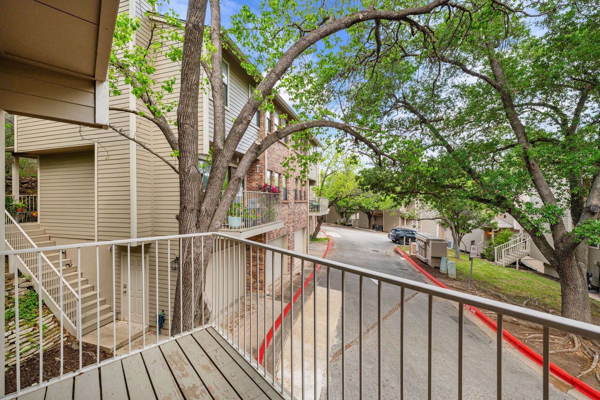 3845 Ranch Road 2222, Unit 19 Austin, TX 78731 - Photo 3 of 38 Elevated on the second floor, this space overlooks the shaded grounds and the quiet neighborhood streets