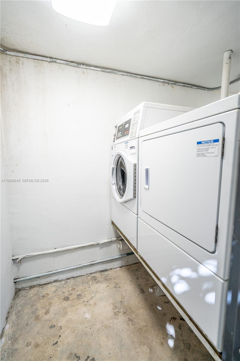 331 85th Street, Unit 17 Miami Beach, FL 33141 - Photo 13 of 16 a utility room with dryer and washer