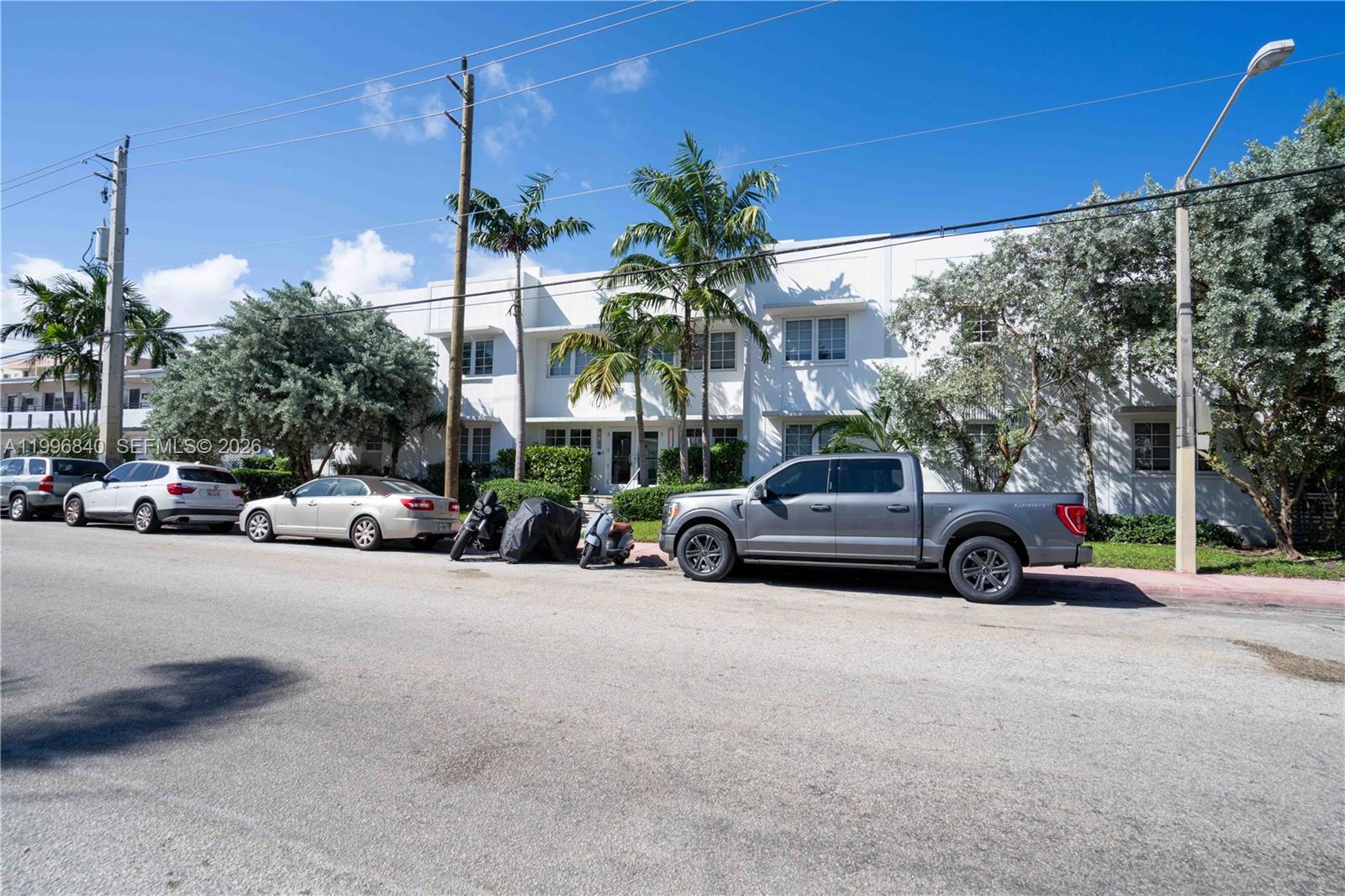 331 85th Street, Unit 17 Miami Beach, FL 33141 - Photo 16 of 16 a car parked on the side of a street
