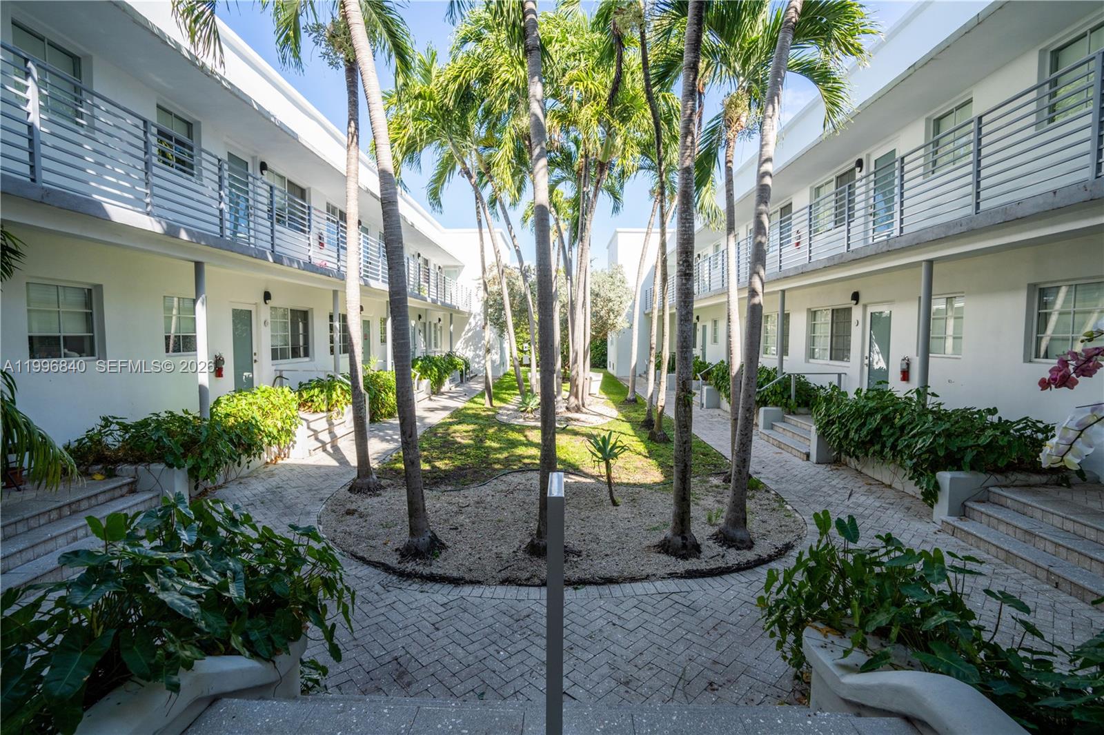 331 85th Street, Unit 17 Miami Beach, FL 33141 - Photo 2 of 16 a view of a building with a garden