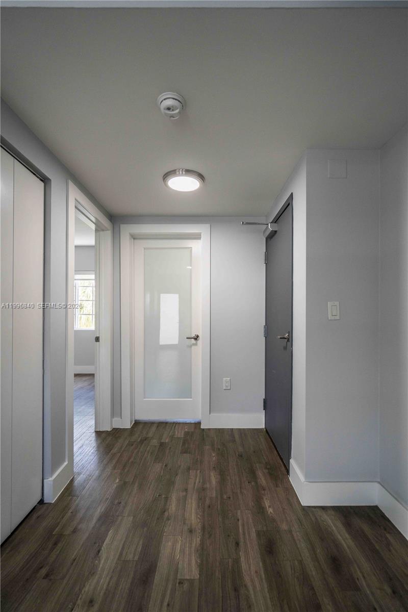 331 85th Street, Unit 17 Miami Beach, FL 33141 - Photo 7 of 16 wooden floor in an empty room with wooden floor