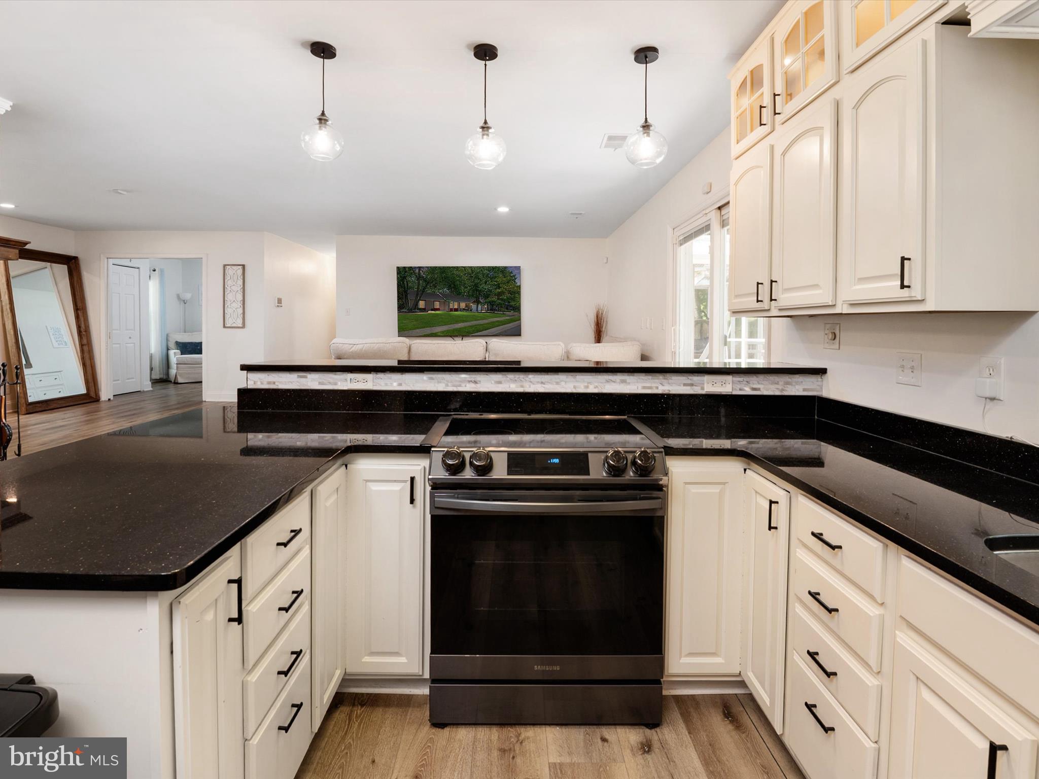 3570 Pine Cone Circle Waldorf, MD 20602 - Photo 13 of 43 a kitchen with stainless steel appliances granite countertop a stove a sink and a microwave
