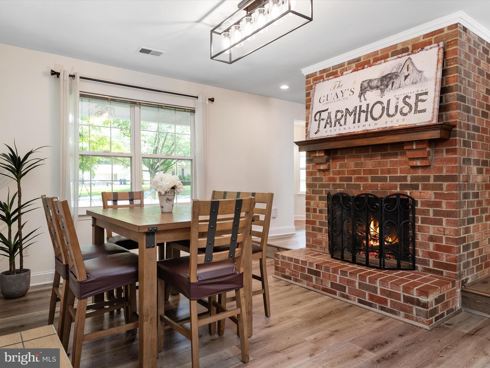 3570 Pine Cone Circle Waldorf, MD 20602 - Photo 14 of 43 a view of a dining room with furniture window and wooden floor