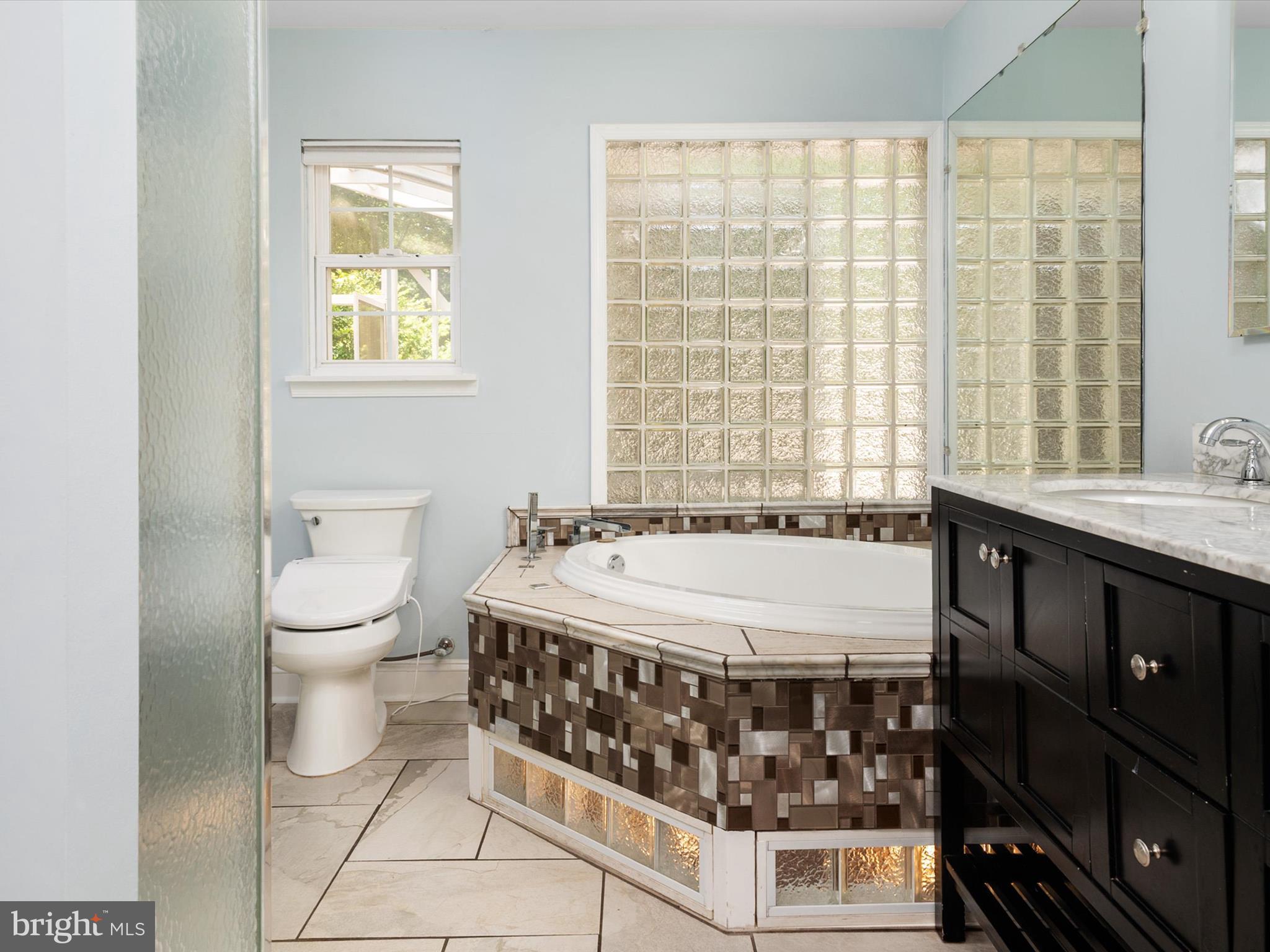 3570 Pine Cone Circle Waldorf, MD 20602 - Photo 23 of 43 a bathroom with a double vanity sink toilet and a tub