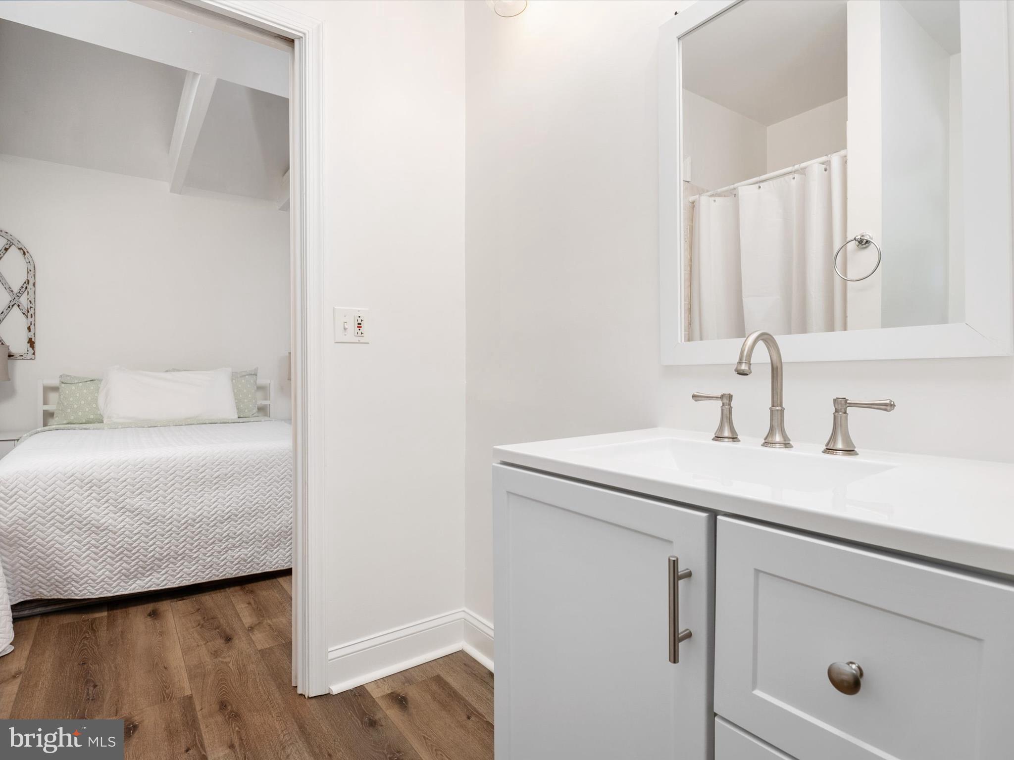 3570 Pine Cone Circle Waldorf, MD 20602 - Photo 31 of 43 a bathroom with a sink and a mirror