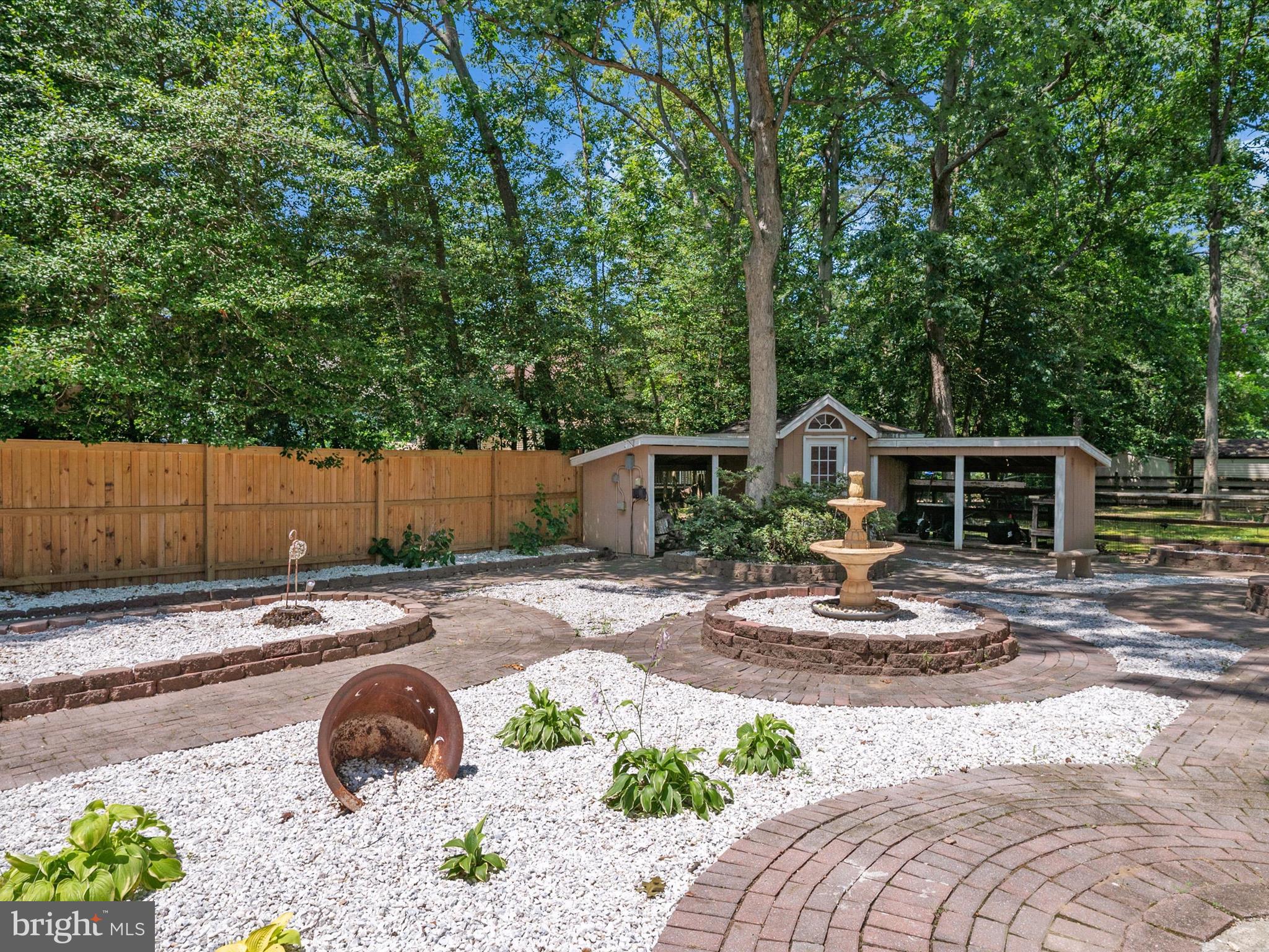 3570 Pine Cone Circle Waldorf, MD 20602 - Photo 36 of 43 a view of backyard with wooden fence and a large tree