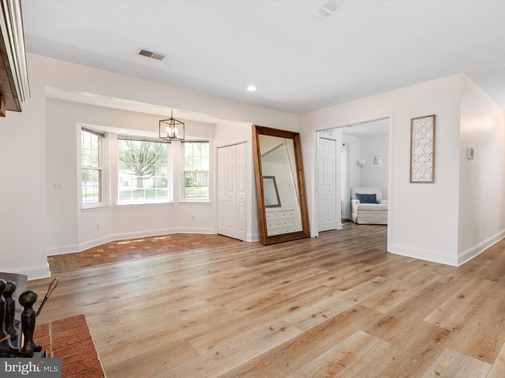 3570 Pine Cone Circle Waldorf, MD 20602 - Photo 7 of 43 a view of empty room with wooden floor and fan