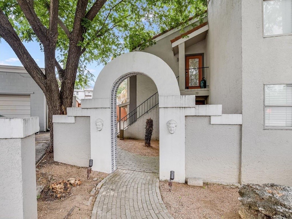 Beautiful arched entrance to community courtyard
