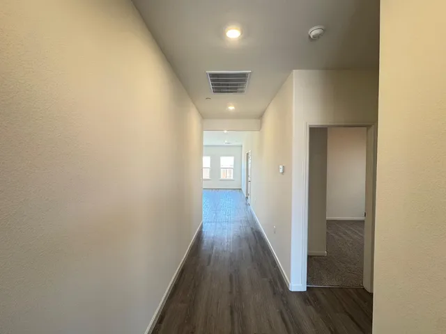 an empty room with closet area