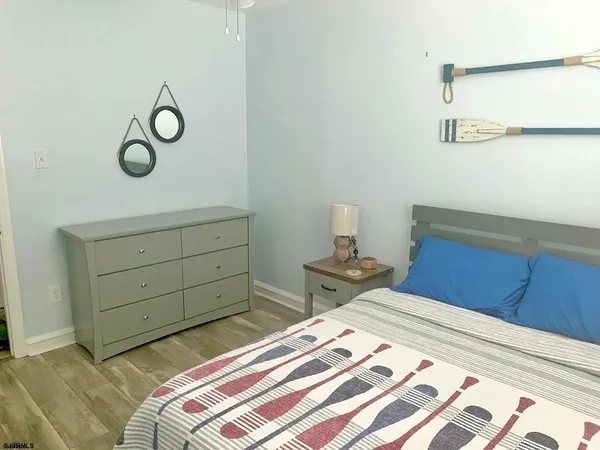 a bedroom with a bed and cabinets