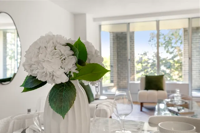 a view of living room with furniture and a large window