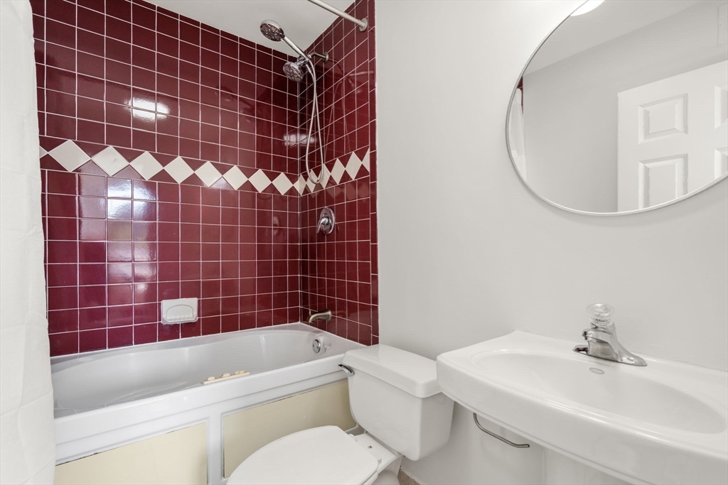 33 Pond Avenue, Unit 523 Brookline, MA 02445 - Photo 14 of 31 a bathroom with a sink toilet and shower