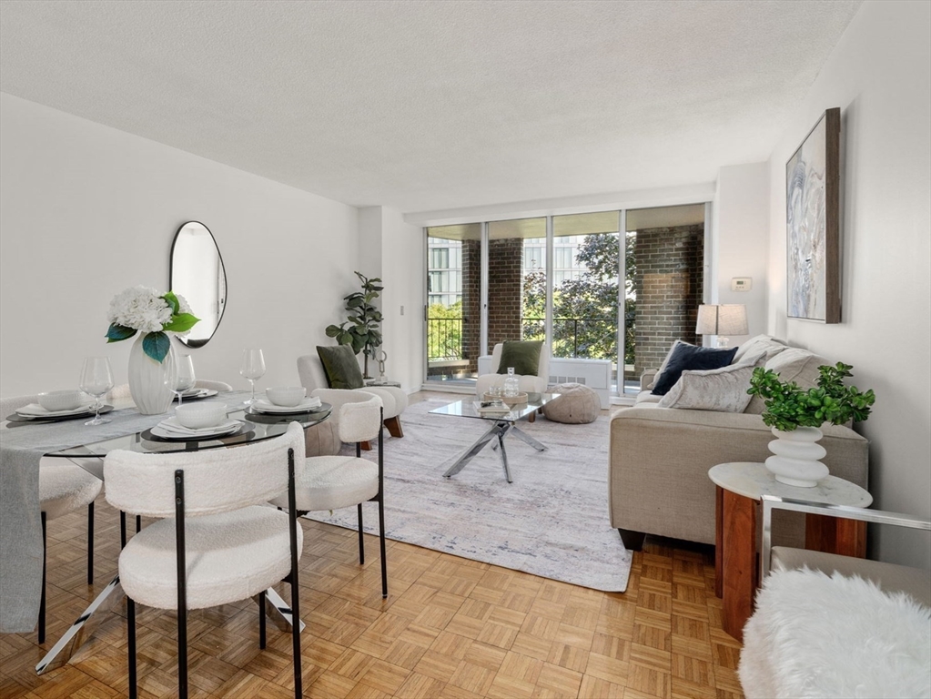 33 Pond Avenue, Unit 523 Brookline, MA 02445 - Photo 18 of 31 a living room with furniture and window