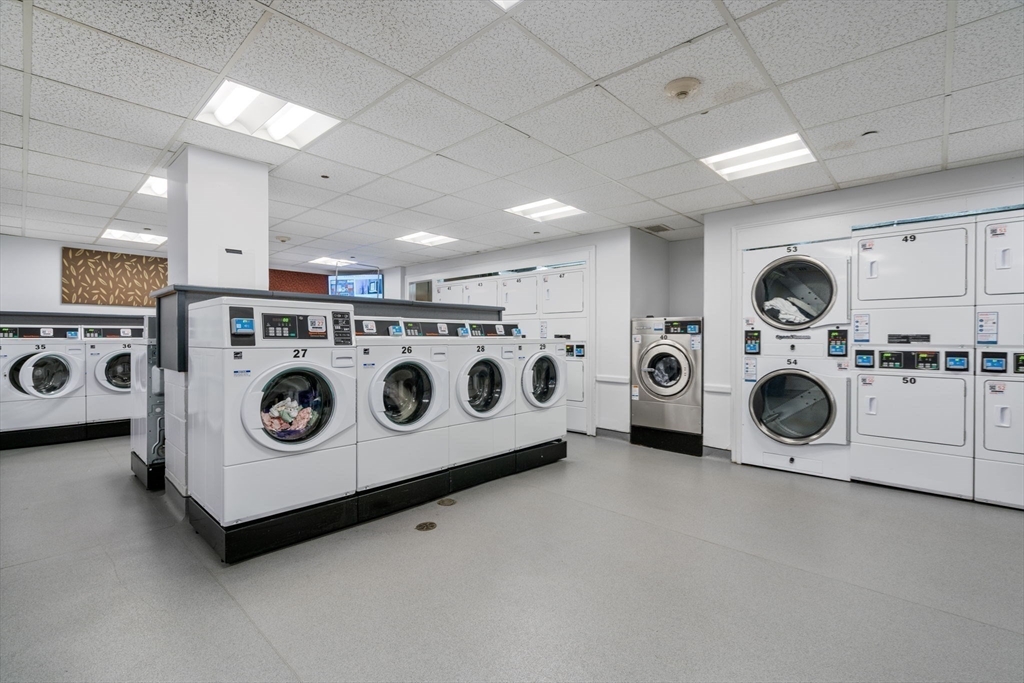 33 Pond Avenue, Unit 523 Brookline, MA 02445 - Photo 22 of 31 a utility room with dryer and washer