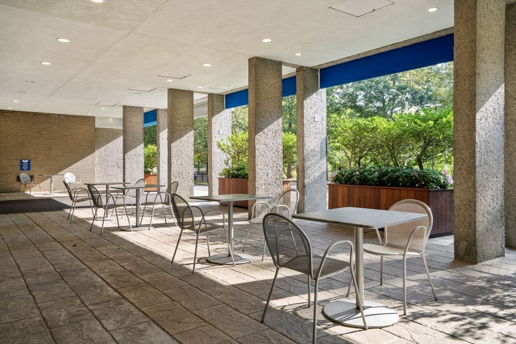 33 Pond Avenue, Unit 523 Brookline, MA 02445 - Photo 23 of 31 a view of a dining room with furniture window and outside view