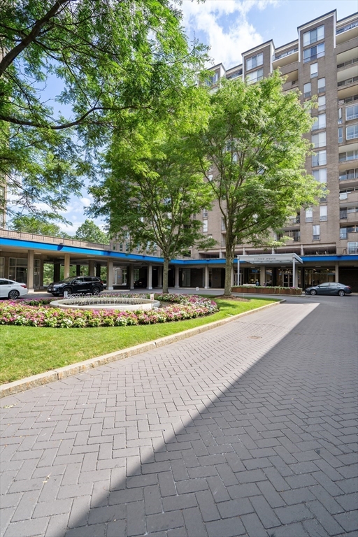 33 Pond Avenue, Unit 523 Brookline, MA 02445 - Photo 25 of 31 a swimming pool with outdoor seating and yard
