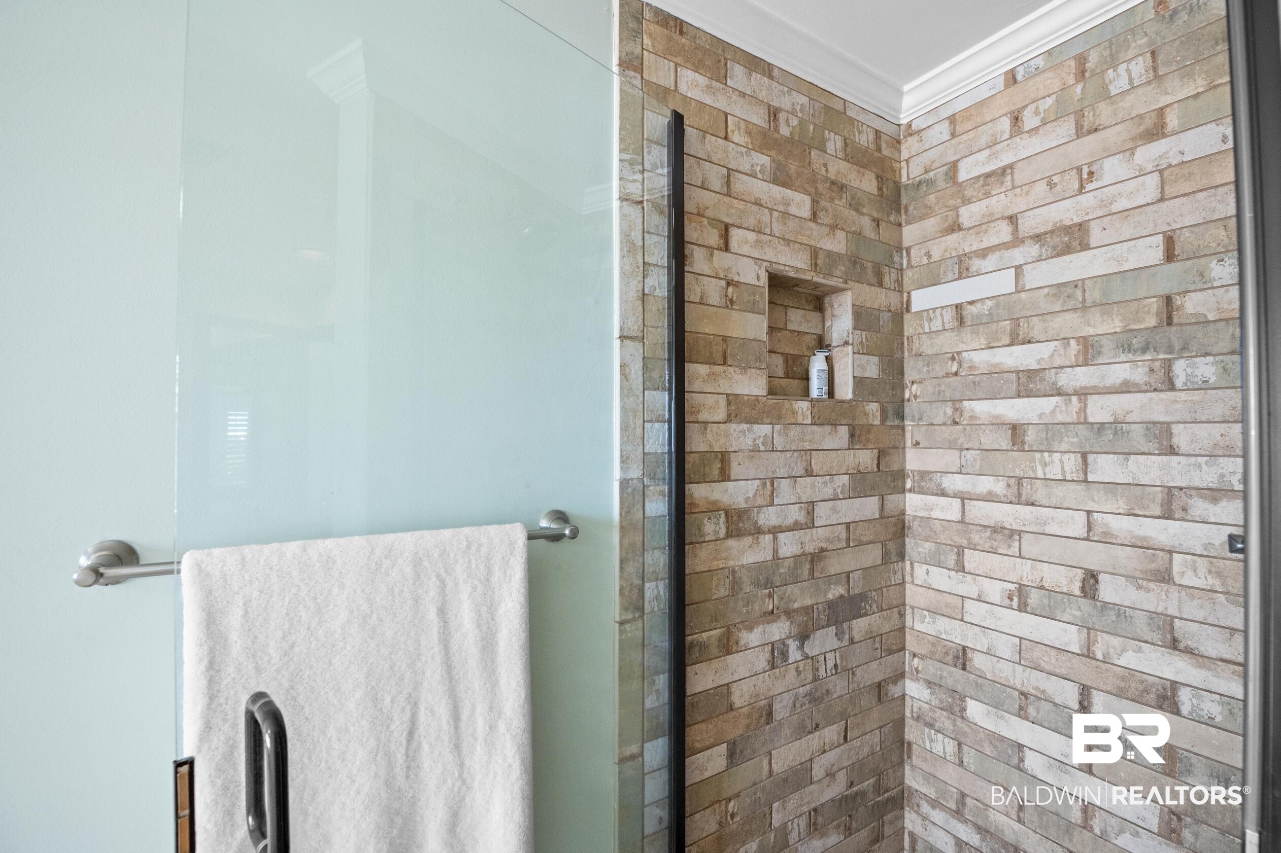 31304 River Road Orange Beach, AL 36561 - Photo 30 of 78 Bathroom with a stall shower and ornamental molding