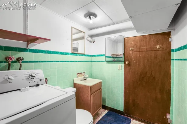 a utility room with dryer and washer