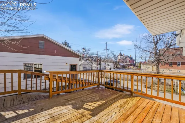 a view of a balcony with wooden floor