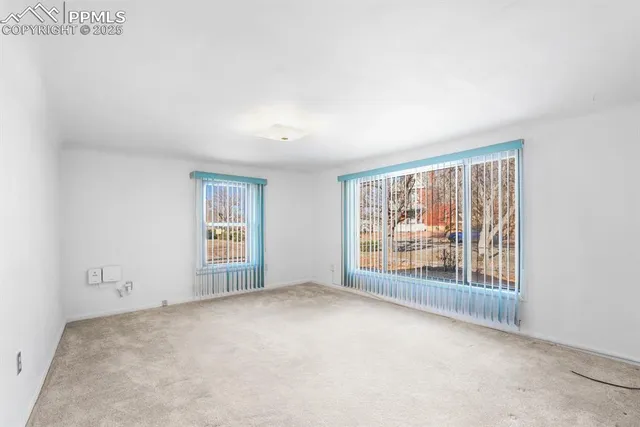 an empty room with windows