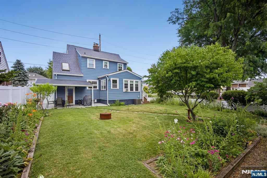 57 Oldis Street Rochelle Park, NJ 07662 - Photo 2 of 19 a front view of a house with a yard