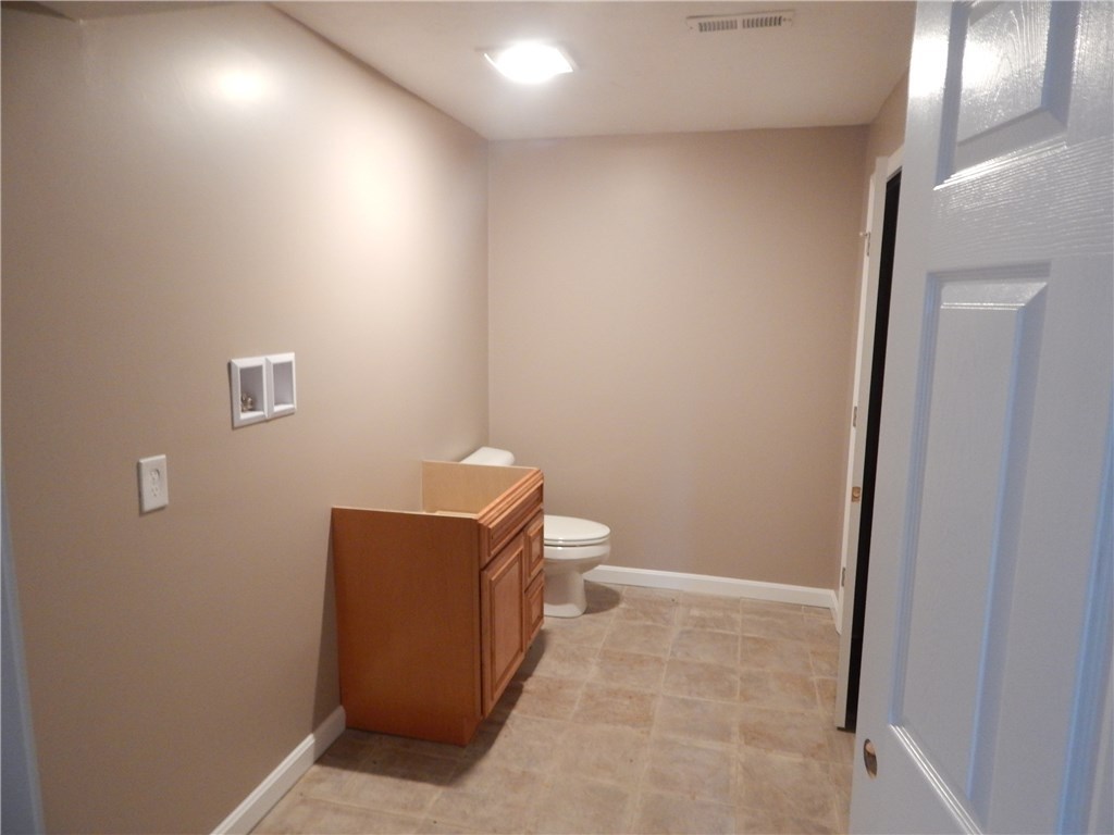 82 Stone Barn Road Burrillville, RI 02859 - Photo 14 of 14 Half bath and laundry room in lower level.