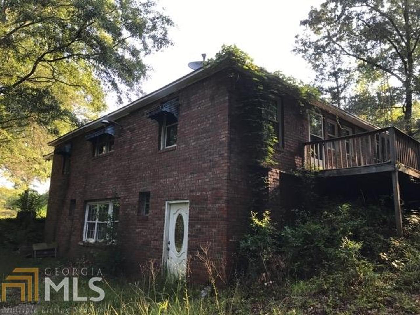 334 Martin Dairy Road Milner, GA 30257 - Photo 1 of 1 a front view of house with yard and green space