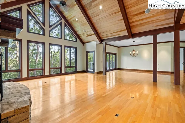 a view of an entryway with wooden floor