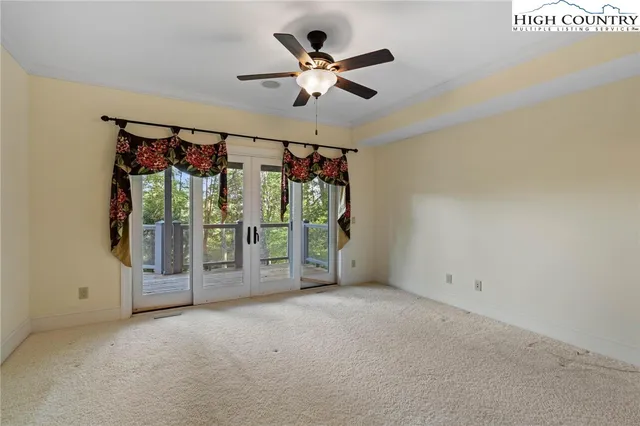 a view of an empty room with a balcony