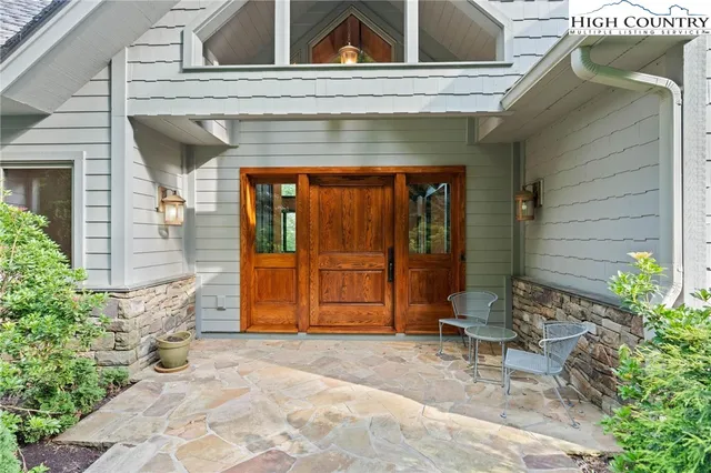 a view of front door of house with seating space