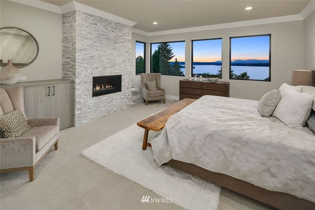 a bedroom with a bed and fireplace