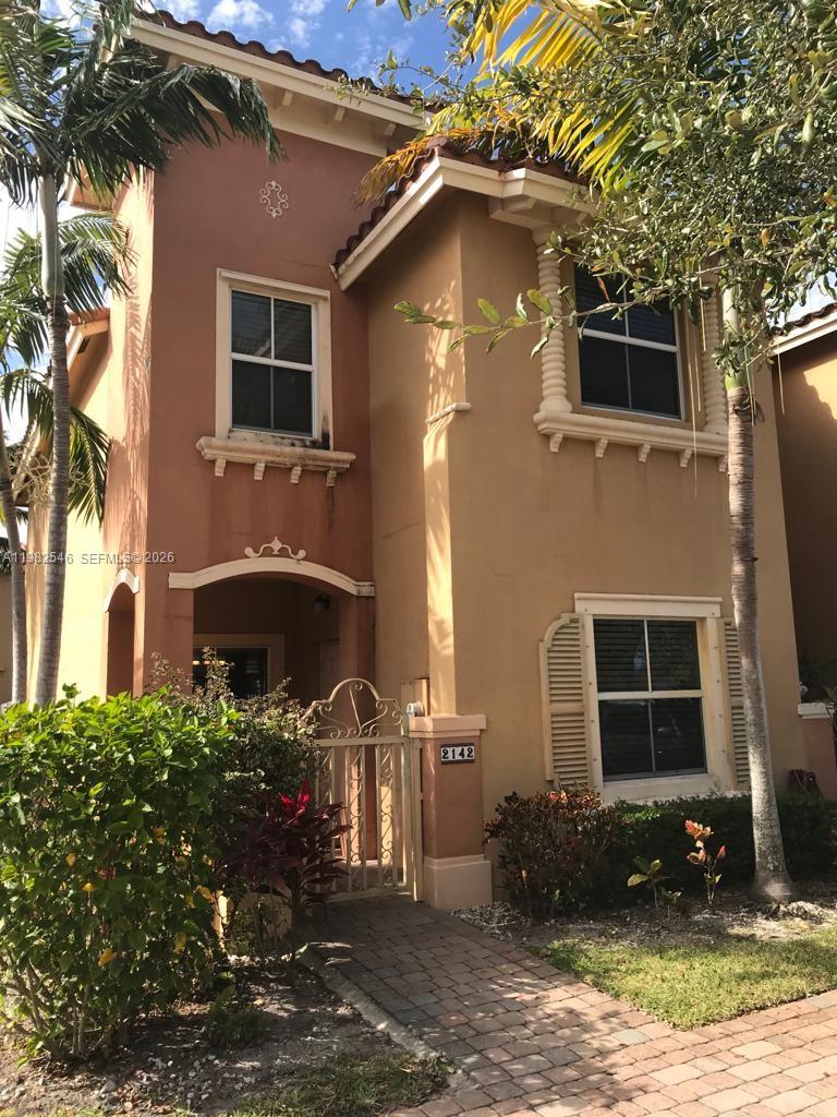 2142 Siena Way Hollywood, FL 33021 - Photo 1 of 13 a front view of a house with a yard