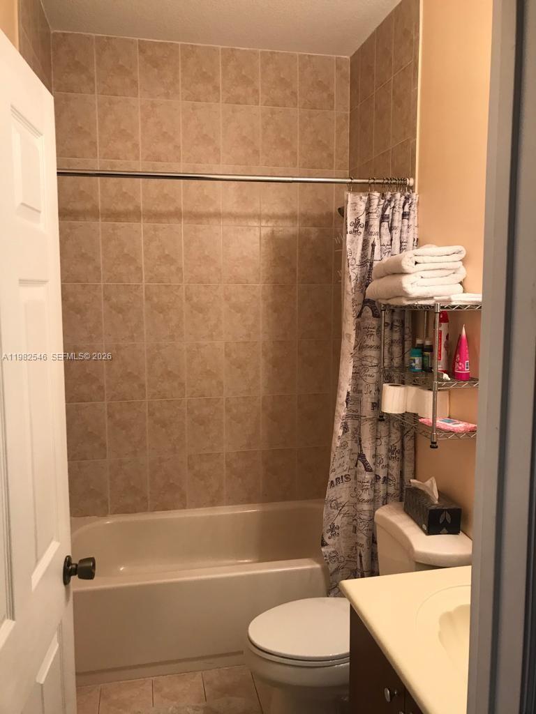 2142 Siena Way Hollywood, FL 33021 - Photo 11 of 13 a bathroom with a sink a toilet and shower