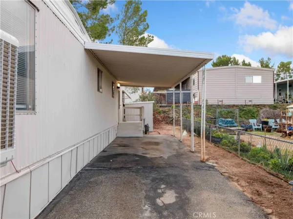 a view of a backyard with a patio