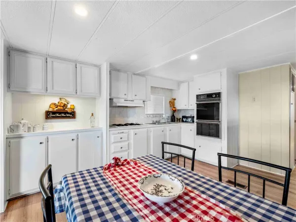 a kitchen with stainless steel appliances granite countertop a refrigerator sink and cabinets