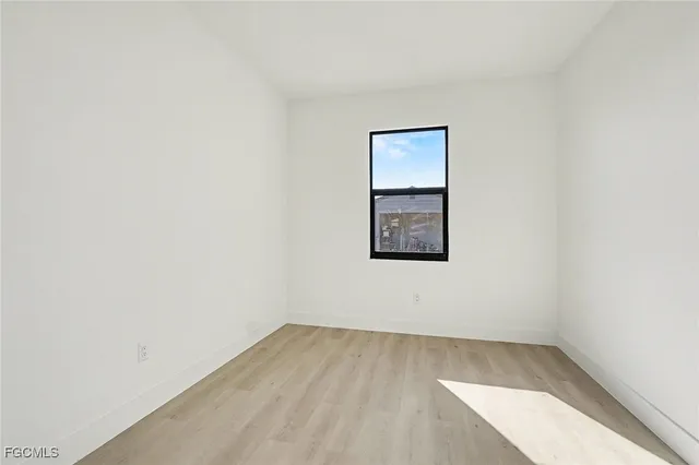a kitchen with kitchen island a sink appliances and cabinets