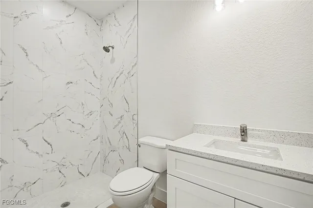 a bathroom with a toilet and a sink