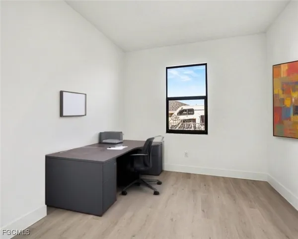 a kitchen with sink and mirror