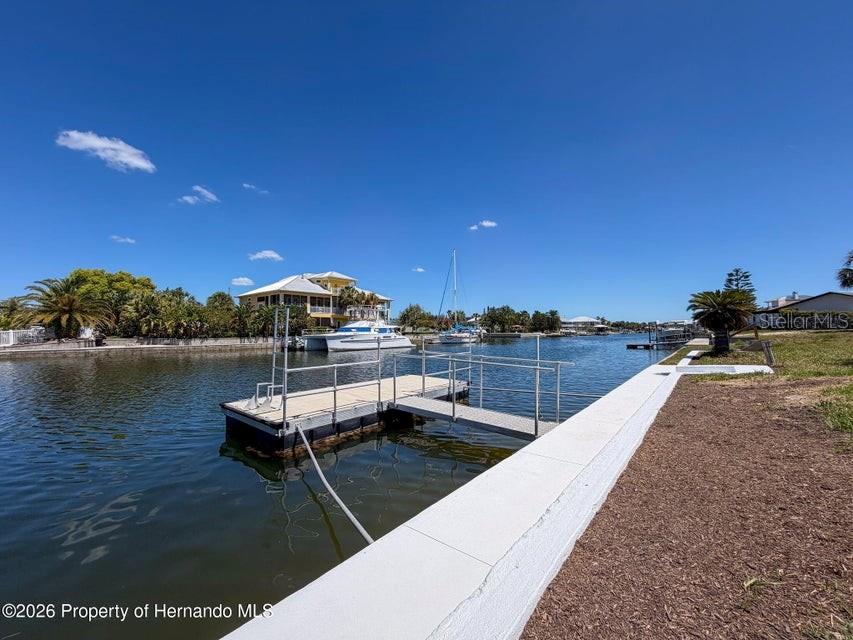 3473 Gulf Coast Drive Hernando Beach, FL 34607 - Photo 12 of 50 a terrace with outdoor seating and city view