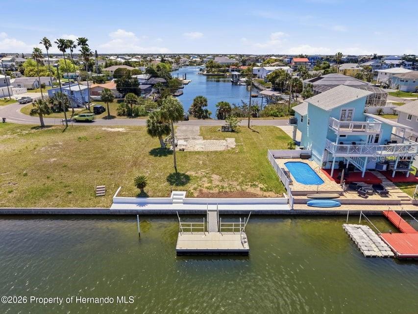 3473 Gulf Coast Drive Hernando Beach, FL 34607 - Photo 14 of 50 a view of a water with boats and trees in the background