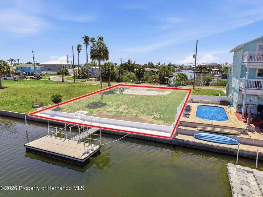 3473 Gulf Coast Drive Hernando Beach, FL 34607 - Photo 44 of 50 a view of a pool with a yard