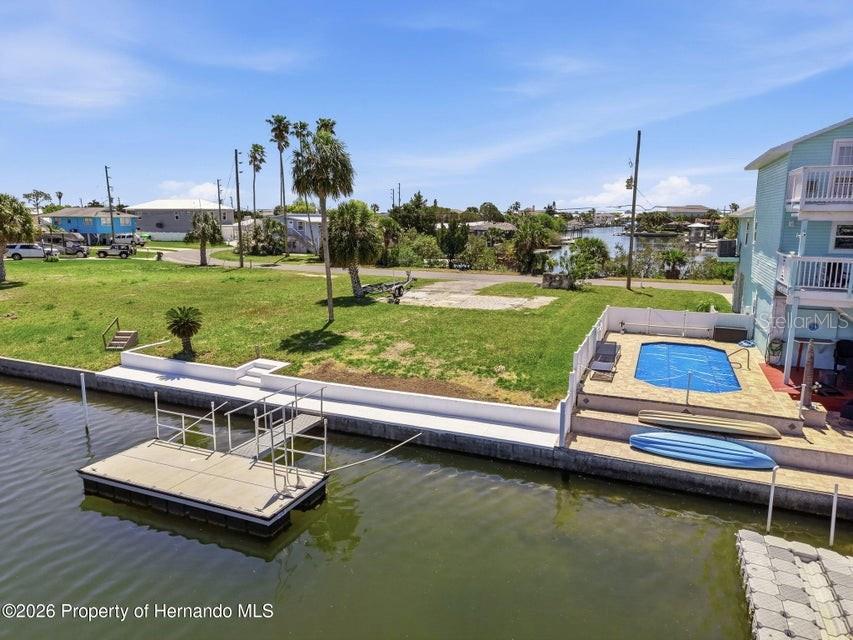 3473 Gulf Coast Drive Hernando Beach, FL 34607 - Photo 45 of 50 a view of a lake with couches chairs