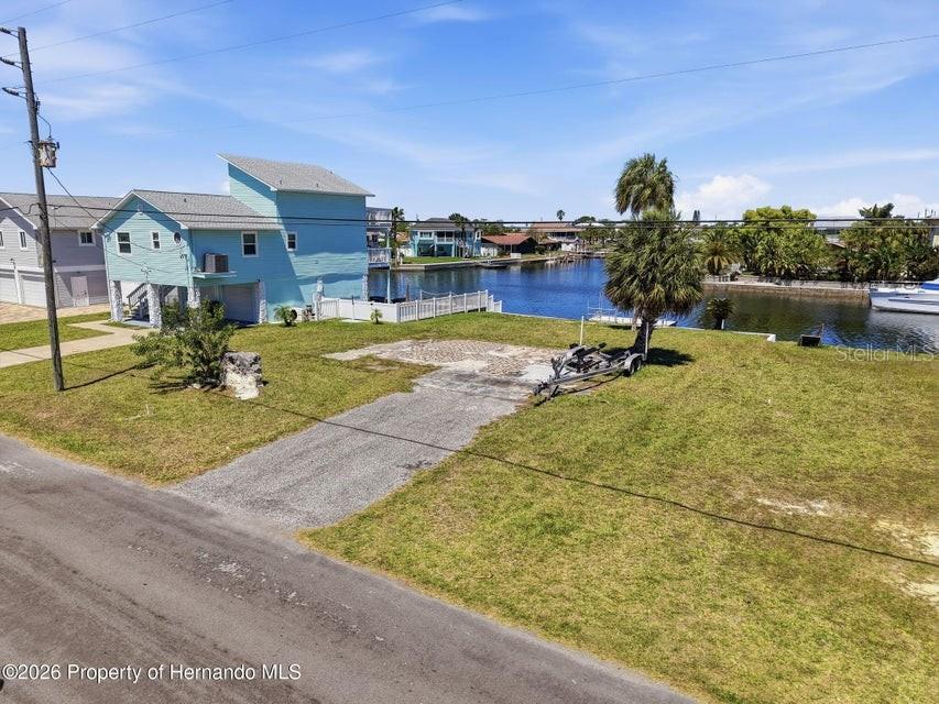3473 Gulf Coast Drive Hernando Beach, FL 34607 - Photo 47 of 50 a view of a swimming pool with a yard