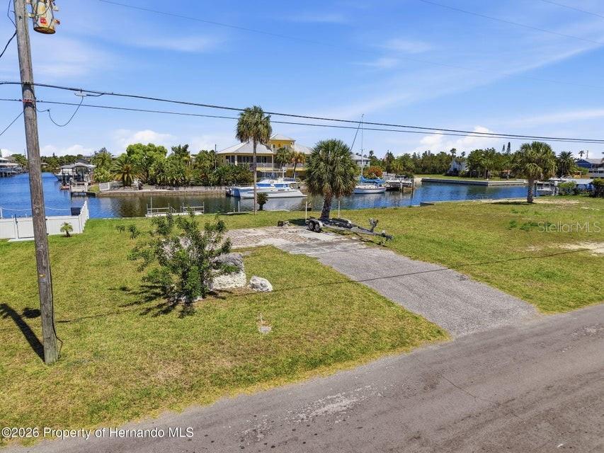 3473 Gulf Coast Drive Hernando Beach, FL 34607 - Photo 50 of 50 a view of a lake with a yard