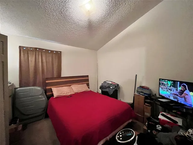 a bedroom with two beds and a closet